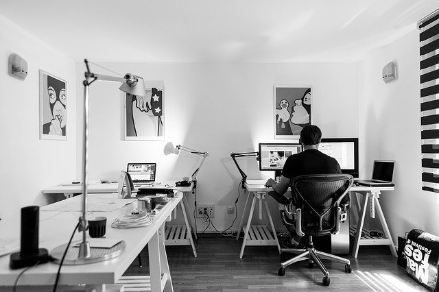 A man designing a website at his work desk