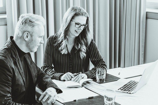 A man and a woman hosting a video conference call