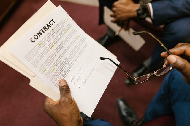 Person holding contract paper
